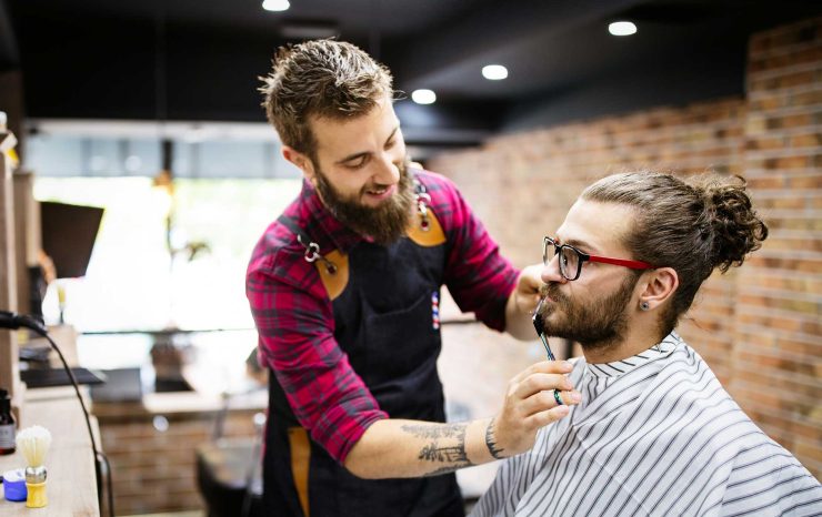 barber-shaving-a-bearded-man-in-a-barber-shop-clo-2021-08-28-09-19-00-utc.jpg